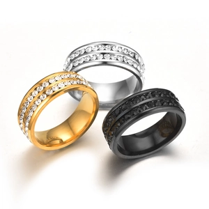 Detailed close-up of double-row rhinestone titanium steel rings in gold, silver, and black