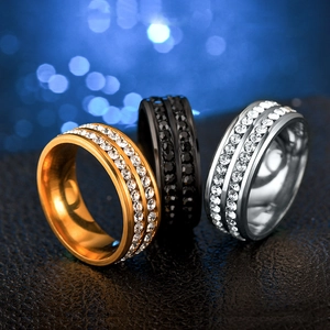 Macro shot of titanium steel rings with double row rhinestones in gold, black, and silver
