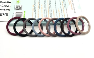 Detailed view of ten multi-color high-elastic braided hair ties with resin buckles