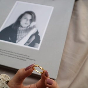 Detailed view of an 18K gold-plated open ring with intricate floral wheat-ear engravings