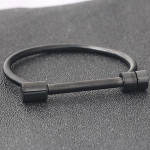 Minimalist 4mm matte black stainless steel horseshoe bangle with industrial bar lock