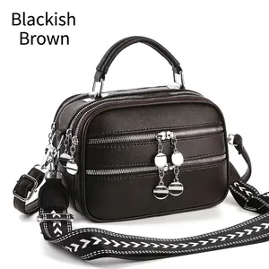 Black brown crossbody bag with three zippers and ethnic style woven strap