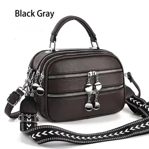 Black grey pebbled leather crossbody bag with triple zipper and woven strap