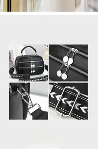 Detail view of black lychee leather bag showing triple zippers and woven shoulder strap