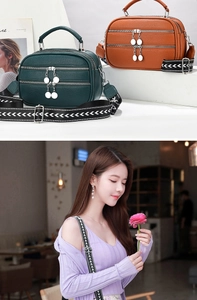 Detail of lychee pattern leather crossbody bag featuring stylish geometric wide strap