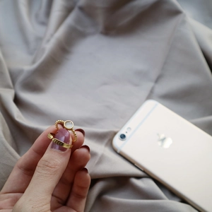 Close-up of gold-plated S925 sterling silver rings with elegant opal and retro details