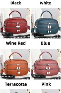 Detail view of multi-color litchi grain PU bags with three-layer zippers and woven straps