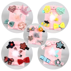 Five sets of cute children hair clips featuring sequin crowns, bows and plush pom poms