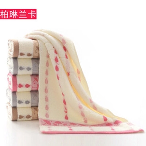 Close-up of cotton towels set with rain patterns in beige, pink, grey and coffee tones