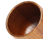 Close-up of polished interior and natural wood grain texture on carbonized wooden cup