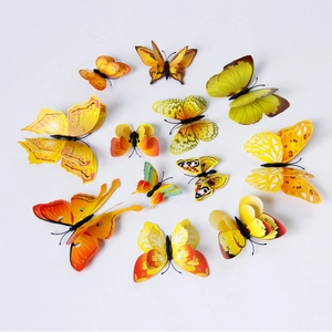 Set of 12 yellow and orange double-layer 3D butterfly wall stickers on white background