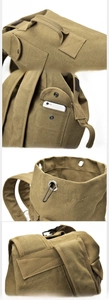 Detail view of khaki canvas backpack showing reinforced handle and front storage pocket