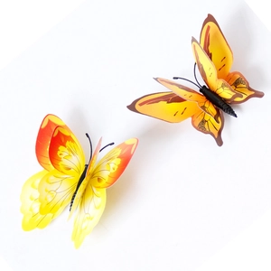 Detail of 3D double-layer butterfly wall stickers with vibrant yellow and orange gradients