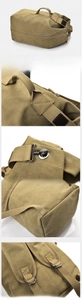 Detail of khaki canvas backpack featuring reinforced stitching and metal hardware hooks