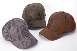 Detailed view of three camouflage baseball hats in grey, olive green, and tan colors