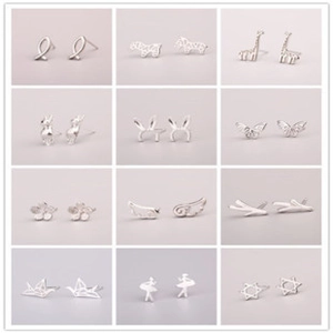 Macro display of twelve assorted silver stud earring styles in a professional grid