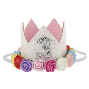 Detail of child birthday crown featuring colorful roses and silver glitter number 3