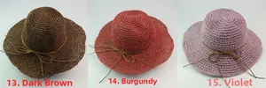 Detail view of woven raffia sun hats in coffee, wine red, and violet with bow accents