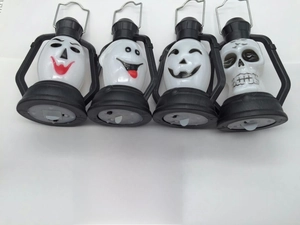 Detail view of four Halloween LED lantern styles featuring ghost and skull designs