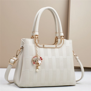 Plaid macaron handbag with ocean shell charm and adjustable strap in creamy white