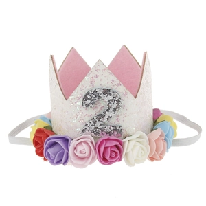 Detail of baby girl birthday crown with glitter number 2 and colorful felt roses