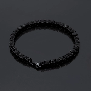 Macro shot of 5mm black rhinestone tennis bracelet with high-gloss stones and clasp