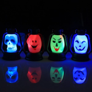 Set of four LED Halloween lanterns featuring blue skull and red pumpkin on a dark surface