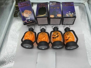 Set of four orange Halloween pumpkin lanterns with purple gift box and festive patterns