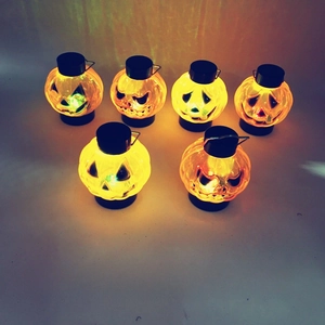 Set of 6 orange Halloween pumpkin lanterns with glowing gradient LED light effect
