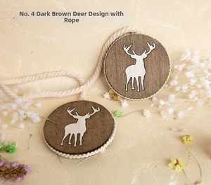 Detail of wooden curtain tieback featuring a white reindeer silhouette and dark coffee ropes