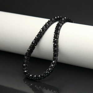 Detailed macro view of 5mm black tennis bracelet with sparkling black rhinestones