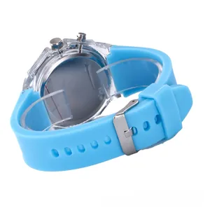 Detail view of the light blue silicone strap and transparent casing of the digital watch