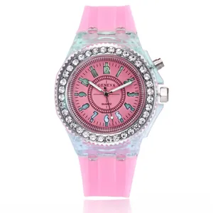 Macro shot of pink LED sports watch with rhinestone bezel and translucent silicone strap