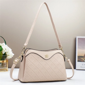 Fashionable beige crossbody bag with clover embossing and golden metal logo charm