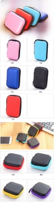 Close-up of square and rectangular EVA hard shell storage cases with zippers in multi-colors