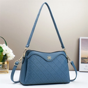 Dusty blue crossbody bag with floral embossing and adjustable strap for women