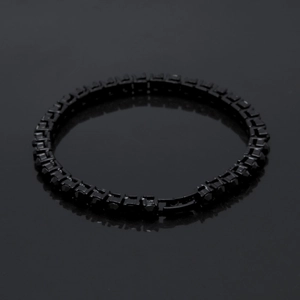 Detail of 5mm black rhinestones tennis bracelet for men with secure clasp on dark background
