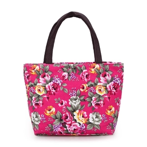 Magenta floral canvas tote bag with rose patterns and dark brown handles for women