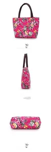 Detailed views of floral canvas tote bag with pink rose print and sturdy brown handles