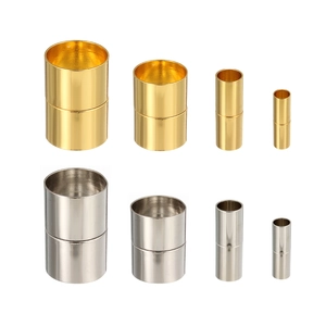 Macro detail of cylindrical magnetic jewelry clasps in gold and silver with various sizes