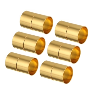 Detailed view of six cylindrical gold magnetic clasps for DIY jewelry making