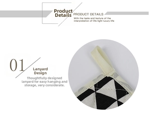 Detailed view of square cotton placemat featuring black geometric pattern and hanging loop