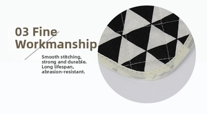 Close-up of quilted cotton place mat with geometric patterns and reinforced edges
