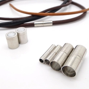 Macro view of cylindrical magnetic jewelry clasps in silver finish for leather cords