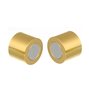 Macro detail of cylindrical gold magnetic clasps for DIY jewelry making accessories