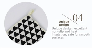 Detail of square quilted cotton trivet with geometric pattern and hanging loop