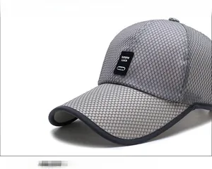Close-up of grey breathable mesh baseball cap with a black TUTUPAI LUCK square leather patch