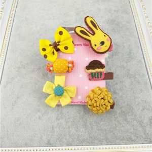 Handmade 6-piece children's hair clip set with yellow bows and rabbit on pink card