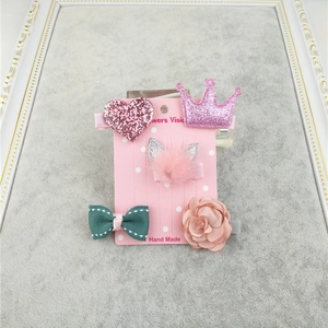 Cute girls' 5-piece hair clip set with pink heart, crown and plush ears on display card