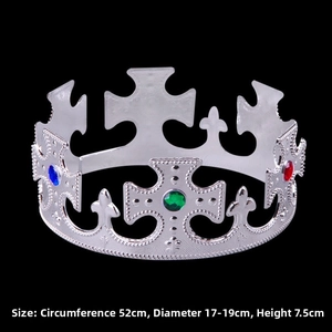 Close-up of silver king crown with colorful gems, electroplated plastic party headpiece detail.